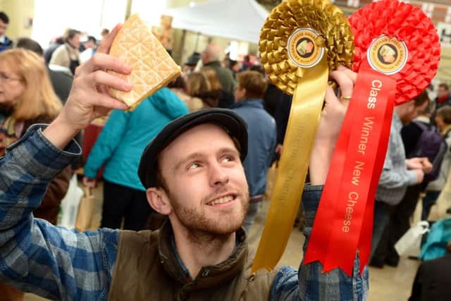 Supreme Champion David Jowett of King Stone Dairy with his rosettes and champion Rollright washed rind cow's milk cheese. EMN-160305-174727001
