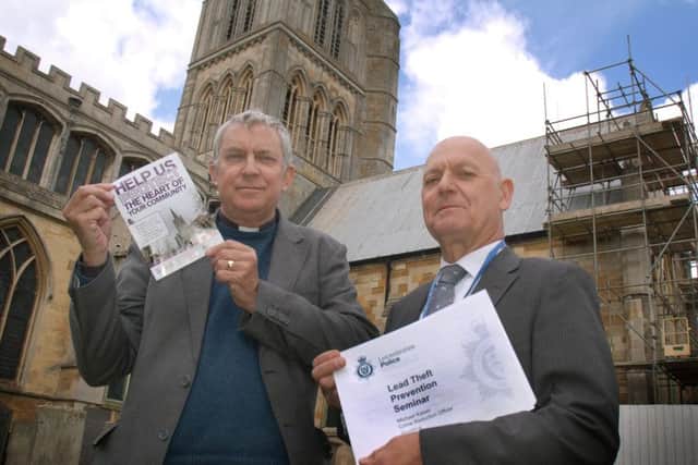 The Rev Kevin Ashby with crime reduction co-ordinator Michael Kaiser outside St.Mary's Church EMN-160429-150932001