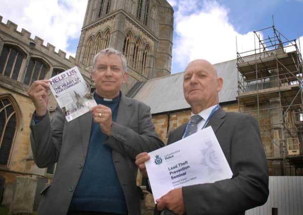 The Rev Kevin Ashby with crime reduction co-ordinator Michael Kaiser outside St.Mary's Church EMN-160429-150932001