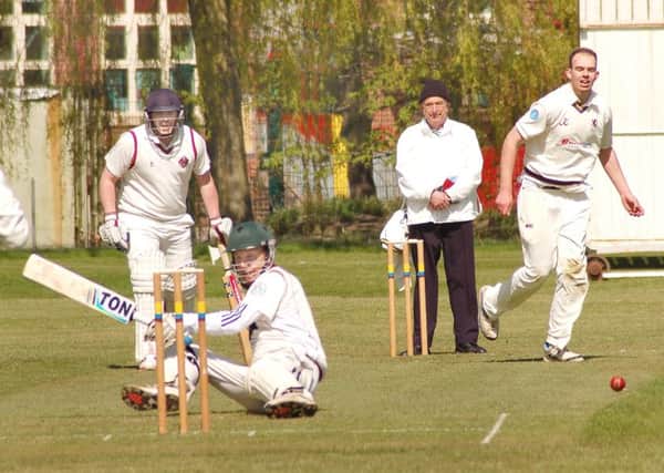 Muxloe's Mark Williamson ends up on the deck after a Tom Glover delivery EMN-160205-161551002