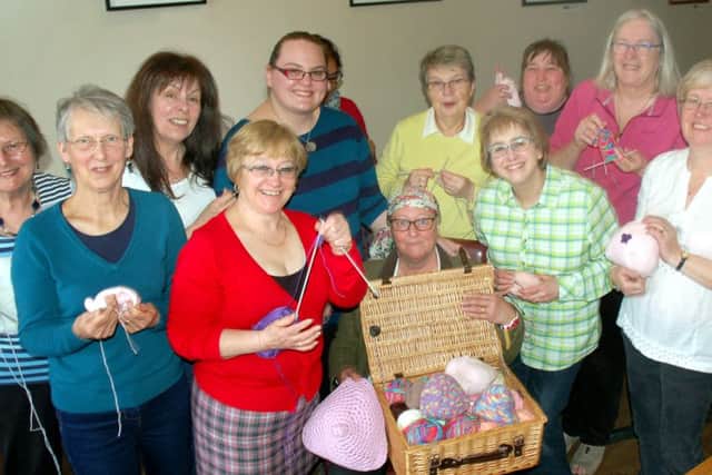 Inspiration for the event Avril Talbot centre) and fellow knitters take a break at More Coffee Co EMN-160405-102543001