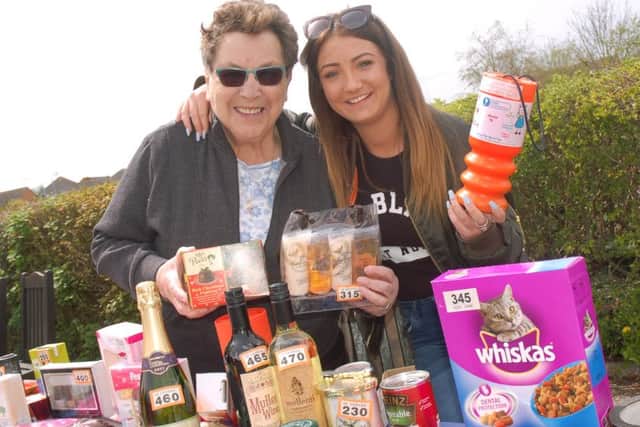 Miss Leicestershire 2016 finalist Georgie Firmager helps out on the tombola with her nan Gloria Dickinson EMN-160405-102953001