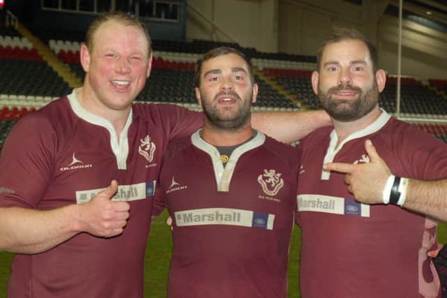 Dedicated Melton RFC servants celebrate the win, from left, Wayne Brooks, captain Marcus Badham and James Stapleford. EMN-160405-115649002