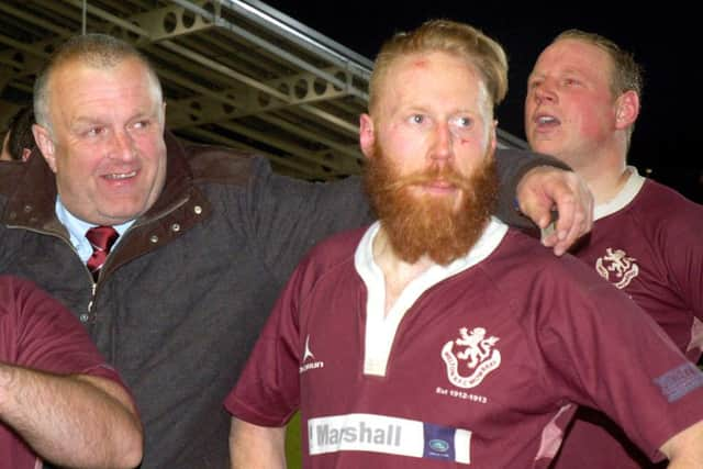 Chairman John Hill with head coach Gareth Collins who shows the scars after guiding his team to a gutsy cup final win EMN-160405-115636002