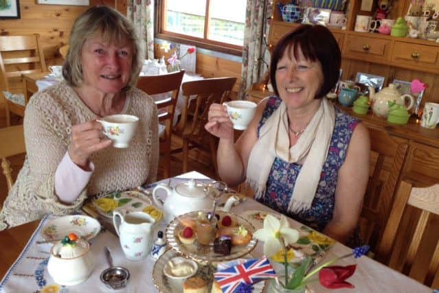 Maureen Ake with her sister enjoying the delights of a decadent royal afternoon tea
PHOTO: Supplied