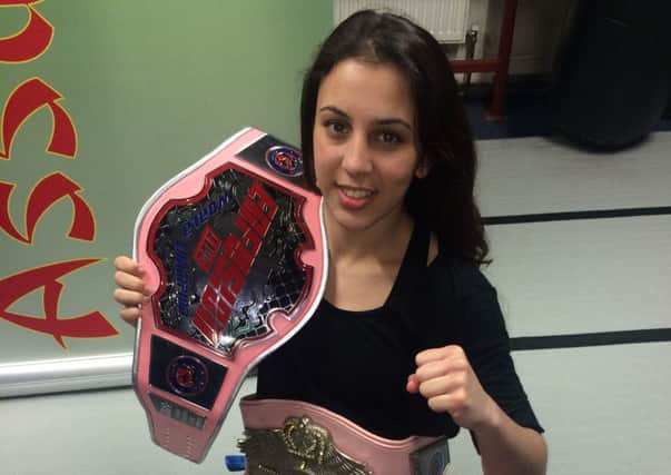 Iman Barlow and her Enfusion world title belts EMN-160405-173609002