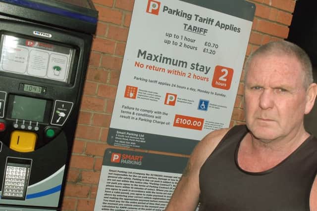Tony Rowe at the new parking sign in the Bell Centre car park EMN-160905-094148001