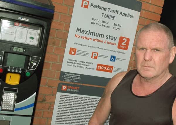 Tony Rowe at the new parking sign in the Bell Centre car park EMN-160905-094148001