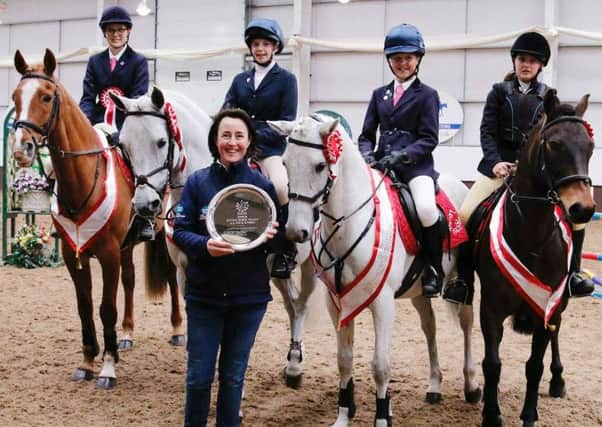 Team manager Tracy Walker with the Rearsby Lodge Riding Club team which won the  junior National Intermediate Show Jumping Championships title, Connie Walker (14), Hannah Spray (12) Lily Walker (12) & Jade England (13) EMN-160905-160616002