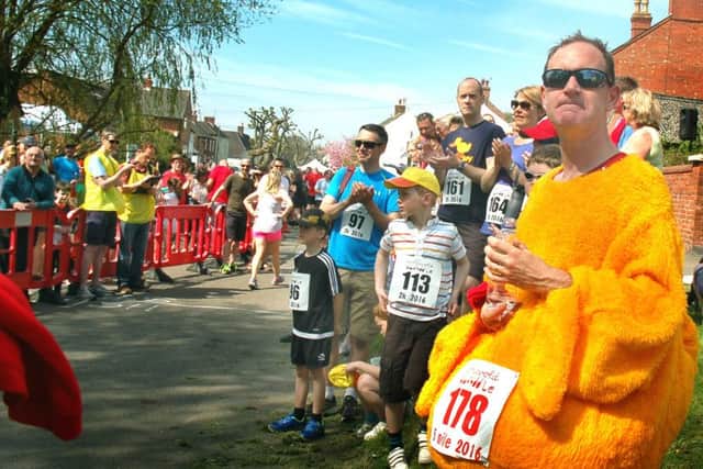 Organiser Chris Taylor keeps an eye on things in feathery costume PHOTO: Tim Williams