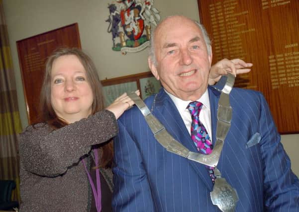 Outgoing Mayor Jeanne Douglas hands over the chain of office to new Mayor of Melton David Wright EMN-160518-094021001