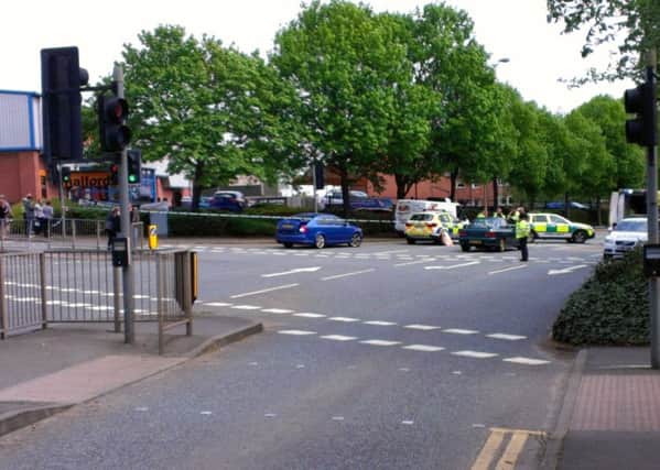 A middle-aged woman was hit by a car as she was crossing Norman Way this afternoon (Friday, May 13) EMN-160513-140539001