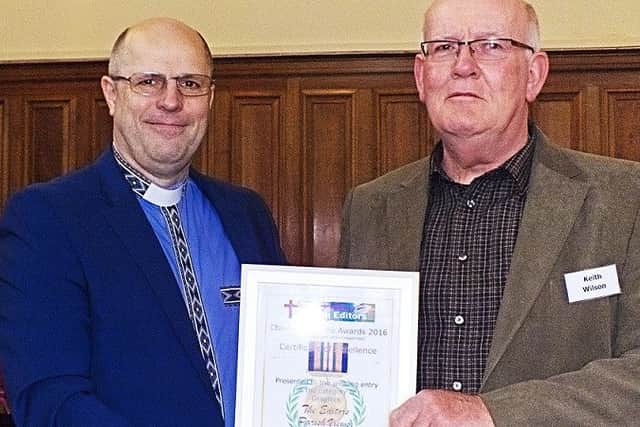 Keith Wilson (right) is presented with his award from Reverend Tony Miles
PHOTO: Supplied