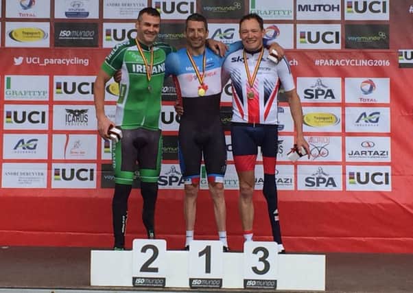 Price climbs his first World Cup podium with silver medallist Colin Lynch and winner Tristen Chernove EMN-160525-141015002