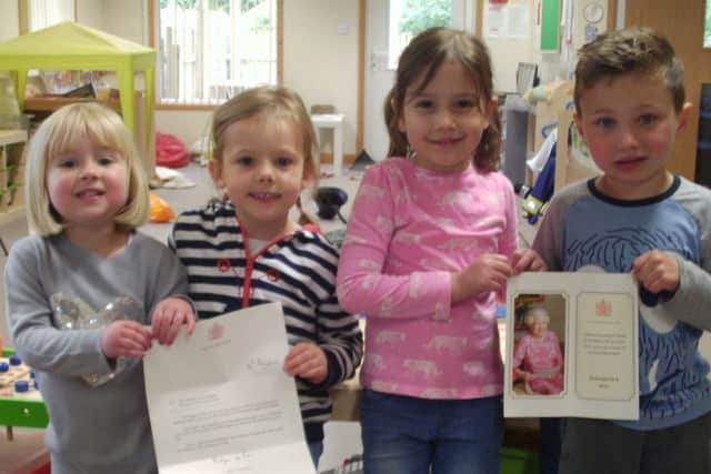 Happy children celebrate after receiving a letter from the Queen PHOTO: Supplied