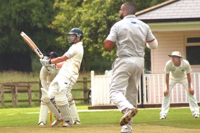 Barkby opener Matt Boyce dispatches Syston bowler Umar Razzaq to the boundary in his 134 EMN-160531-094644002