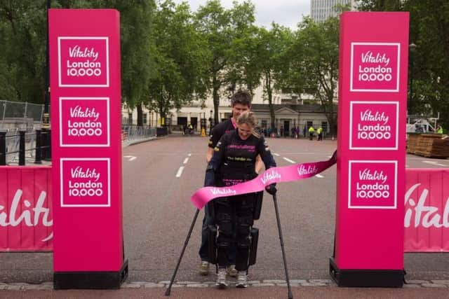 Eye Kettleby mum-of-one Claire Lomas crosses the finish line of the Vitality London 10,000 EMN-160531-183005001