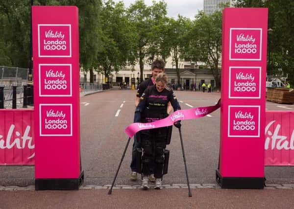 Eye Kettleby mum-of-one Claire Lomas crosses the finish line of the Vitality London 10,000 EMN-160531-183005001