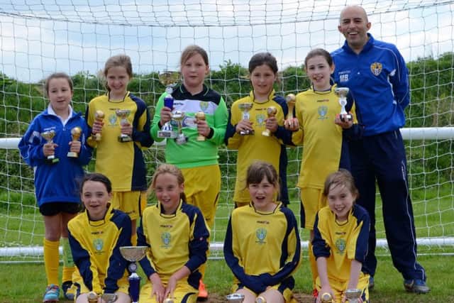 Bottesford under 10s girls team with the Leicestershire City and County League Cup EMN-160531-160844002