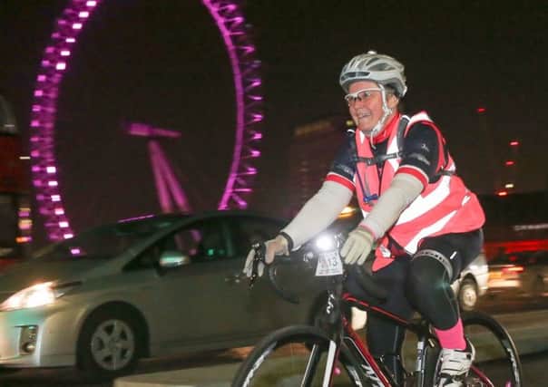 Donna Compton rides past the London Eye PHOTO: Sportivephoto - Colin Addison