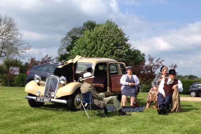 A 1938 Citroen Traction Avant with a suitably attired picnic party enjoying a sunny afternoon picnic on the lawns in front of the Old Brickyard Tea Garden in Scalford
PHOTO: Supplied
