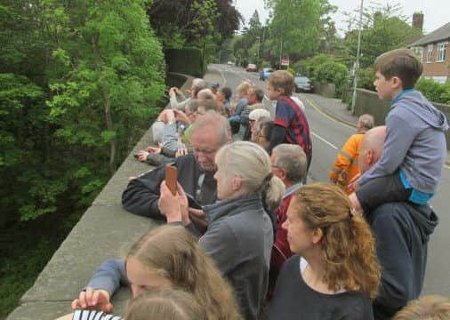 People of ages gathered on the Dalby Road bridge in Melton on Saturday to get a glimpse of Flying Scotsman EMN-160606-095010001