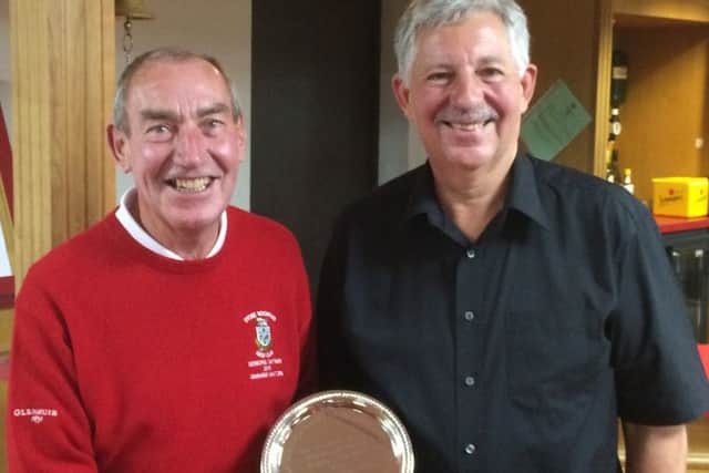 Radcliffe seniors captain Steve Bostock (right) presents the 'Friendship' Salver to his opposite Stoke Rochfpord number, Graham Manton EMN-160706-153240002