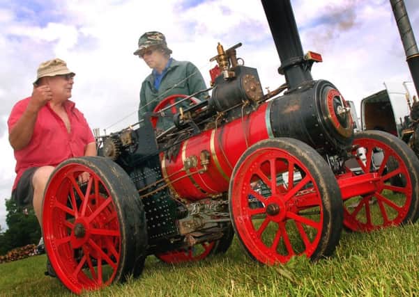 Pat Franks and June Riley discuss Pat's 4''scale model Foster engine PHOTO: Tim Williams