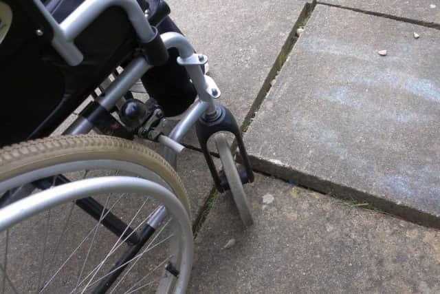 Concerns have been raised about the uneven paving slabs, and the gaps between them, in Drummond Walk EMN-160806-153427001