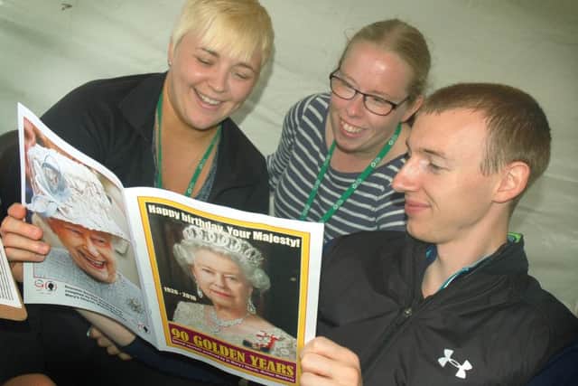 Melton Council staff Sarah Milner, Hannah Buck and Dave Alexander study some regal reading EMN-160613-095618001