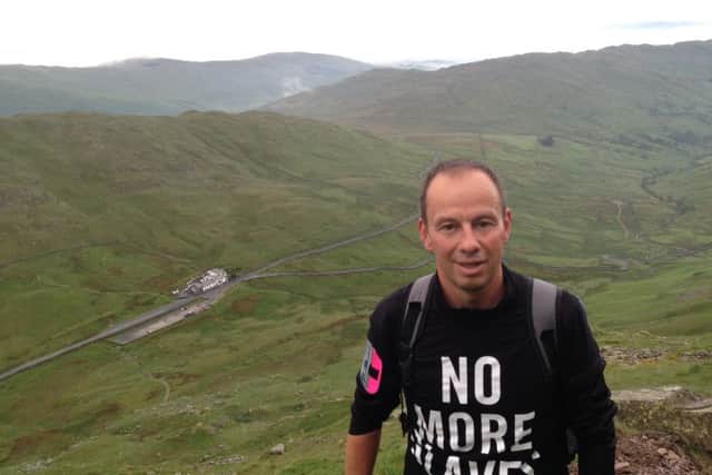 Melton man Andrew Wrath, who climbed 24 peaks in 24 hours in support of the charity Hope for Justice, is pictured here on his way up 'Red Screes' in the Lake District EMN-160614-125603001