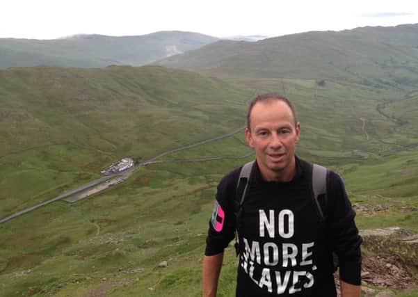 Melton man Andrew Wrath, who climbed 24 peaks in 24 hours in support of the charity Hope for Justice, is pictured here on his way up 'Red Screes' in the Lake District EMN-160614-125603001