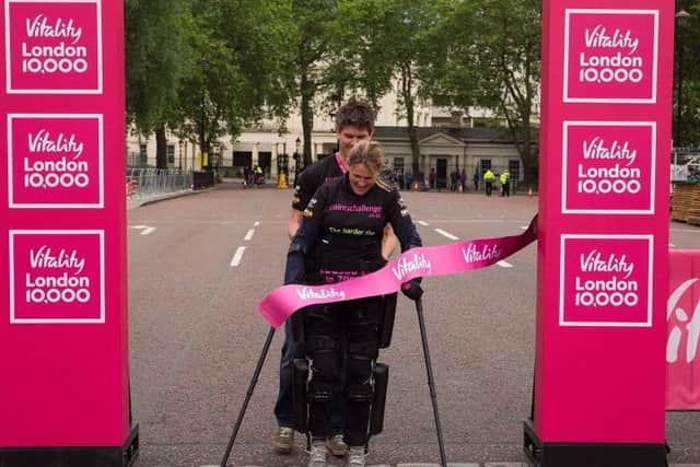 Eye Kettleby mum-of-one Claire Lomas crosses the finish line of the Vitality London 10,000 EMN-160615-125134002