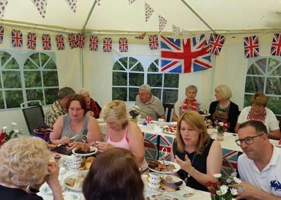 Guests enjoy tea, cakes and sandwiches in the garden
PHOTO: Supplied