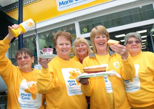 Marie Curie fundraisers serve up tea and cake at their fundraising party 
PHOTO: Tim Williams