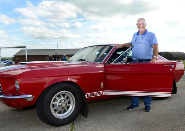 Melton man Ken Eggleston with the 60s Ford Mustang he drove during the Macular Society supercar driving day EMN-160628-114241001