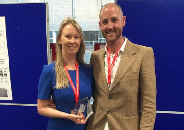 Melton woman Rebecca Breslin with her award and Dr David Adlam EMN-160107-163812001