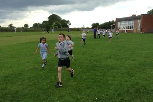 Wymondhams St Peters CE Primary School held a Race for Life on their school field PHOTO: Supplied