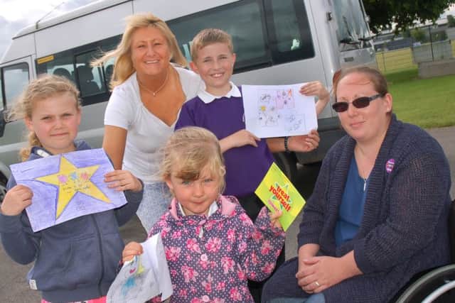 Lynda Spargo and Friends of Sherard member Kirsty Stewart with Leah Adams, Ellis Fletcher and Rosie Mina with their winning designs
PHOTO: Tim Williams