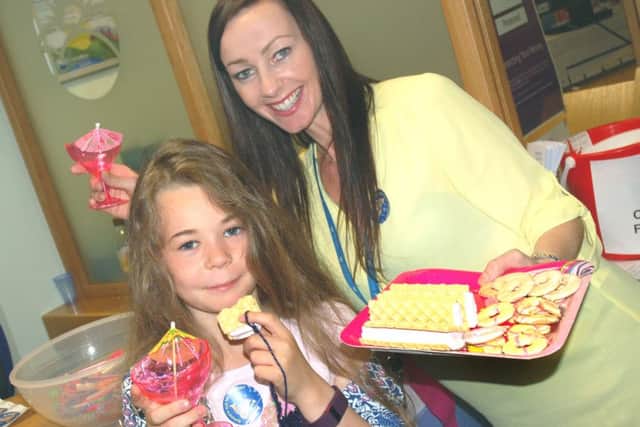 Toni Shelton had help from daughter Taig selling cakes and cocktails PHOTO: Tim Williams