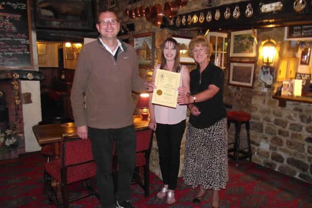 Melton CAMRA chairman Kevin Billson presents Stilton Cheese Inn landlady Carol Evans and her daughter Lynne Bruno with their Pub of the Year award EMN-161007-140004001