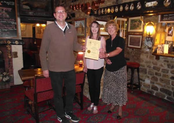 Melton CAMRA chairman Kevin Billson presents Stilton Cheese Inn landlady Carol Evans and her daughter Lynne Bruno with their Pub of the Year award EMN-161007-140004001