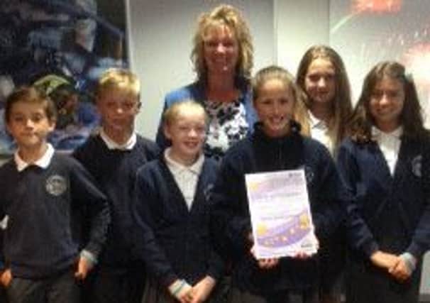 Redmile CE Primary School executive headteacher Julie Hopkins and children from the school's anti-bullying steering group  with their Beyond Bullying Award EMN-161007-144236001