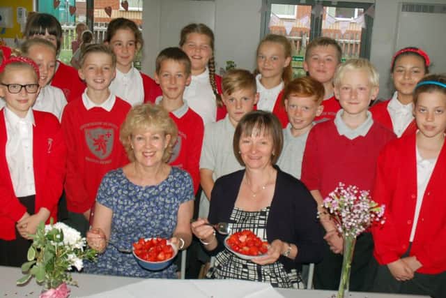 Long-serving Brownlow Primary School teachers Lynne Cliff and Teresa Woods at the tea party with pupils EMN-161107-153901001
