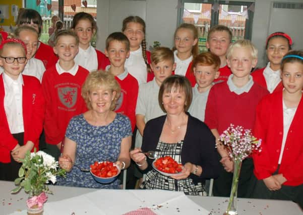 Long-serving Brownlow Primary School teachers Lynne Cliff and Teresa Woods at the tea party with pupils EMN-161107-153901001