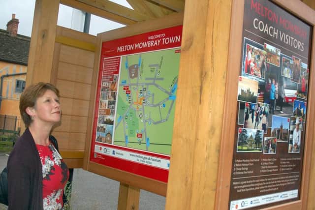 Melton town centre manager Shelagh Core inspects one of the new signs EMN-161207-111720001