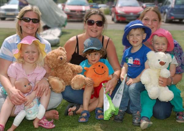Family and friends at a Teddy bears' picnic 
PHOTO: Tim Williams