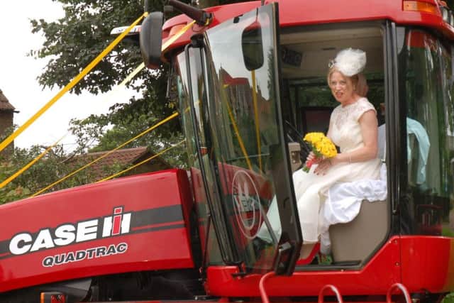 Bride Ruth Stanley surveys the view from her unusual transport EMN-160719-182521001