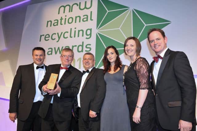 Ex England rugby star Kyran Bracken (right) presents the award to representatives from Melton Foods and Veris Strategies EMN-160714-194937001