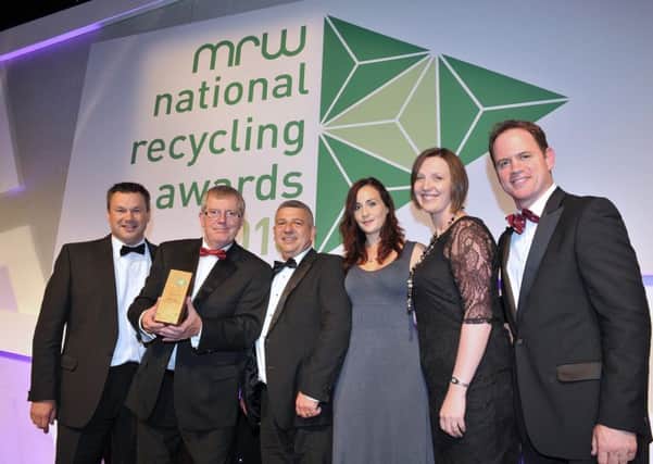 Ex England rugby star Kyran Bracken (right) presents the award to representatives from Melton Foods and Veris Strategies EMN-160714-194937001